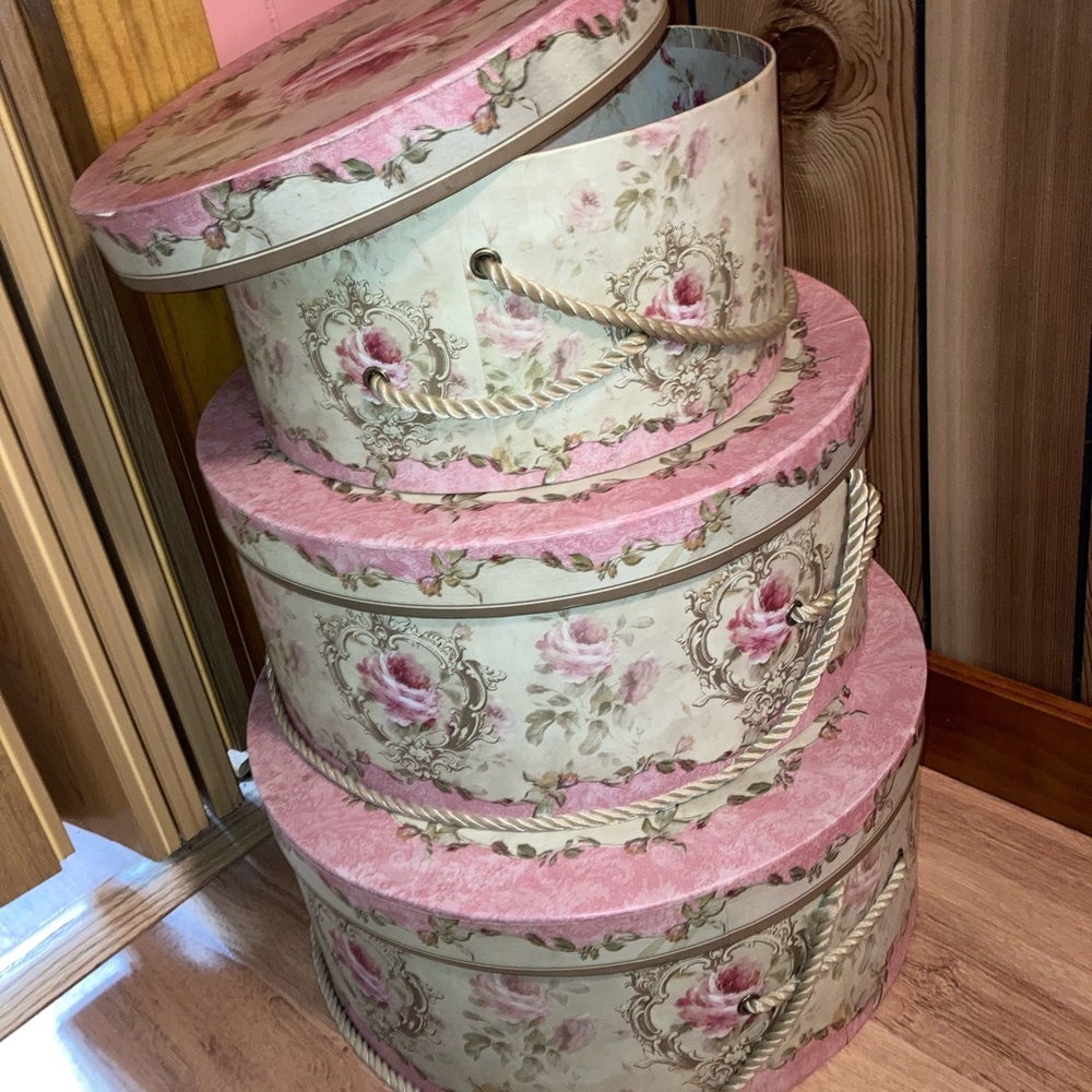 Three matching hat boxes